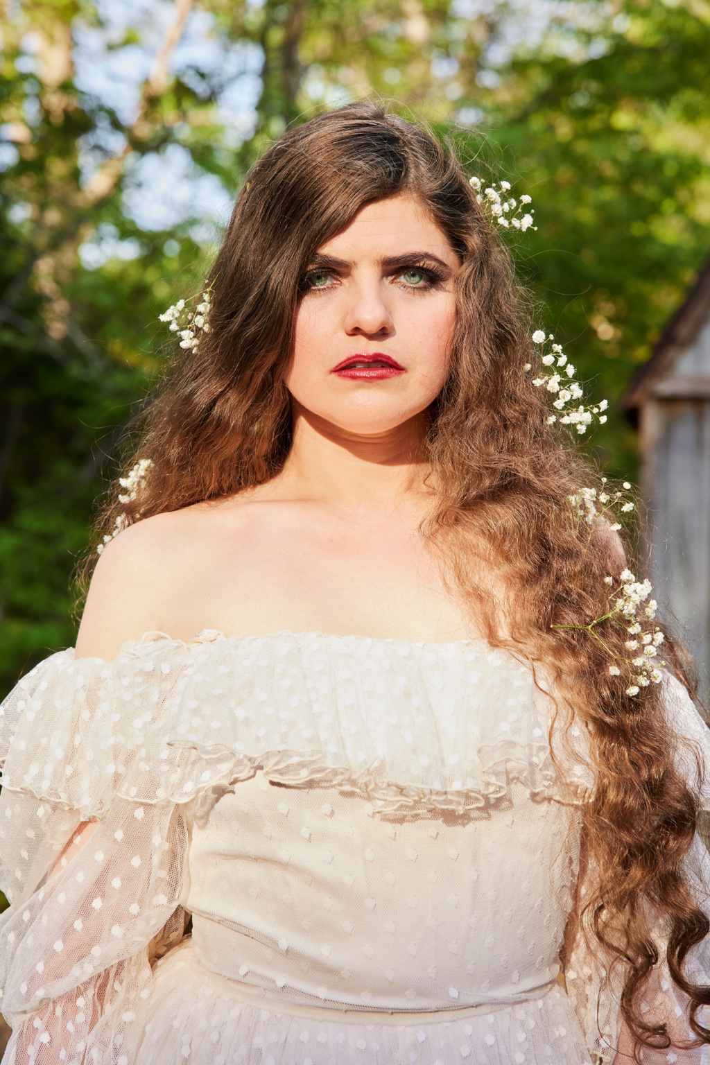 Outdoor portrait of Nettie with flowers in her hair